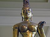 British Museum Top 20 06 Gilded Bronze Tara 6. Standing Tara  Sri Lanka, 8C AD, 143cm high. The statue of Tara, the consort of Avalokiteshvara, is solid cast in one piece of bronze and gilded. The goddess is naked to the waist with a lower garment flowing to her ankles. The marked contrast of the slender waist against heavy breasts and hips is the ideal of feminine beauty. Tara's right hand is shown in the mudra of giving; her left hand is empty but may have held a lotus flower.